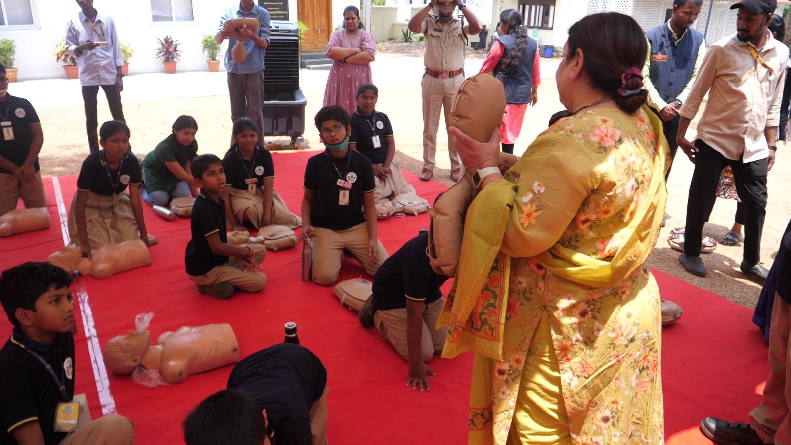 Citizens learning CPR on training mannequins