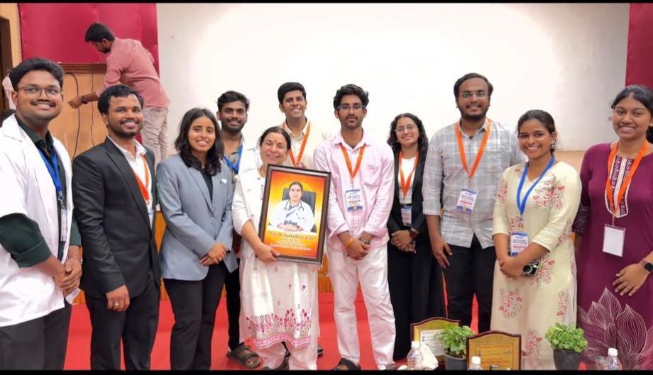 GKF volunteer team with Dr. Anita Bhalla holding her portrait